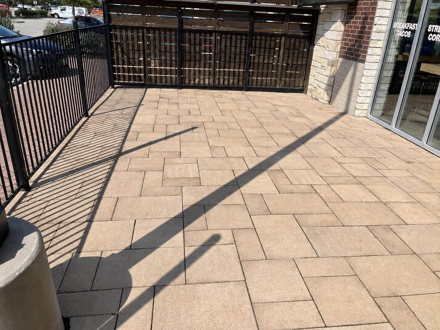 The same restaurant paver patio after pressure washing, the pavers back to their original warm tan.